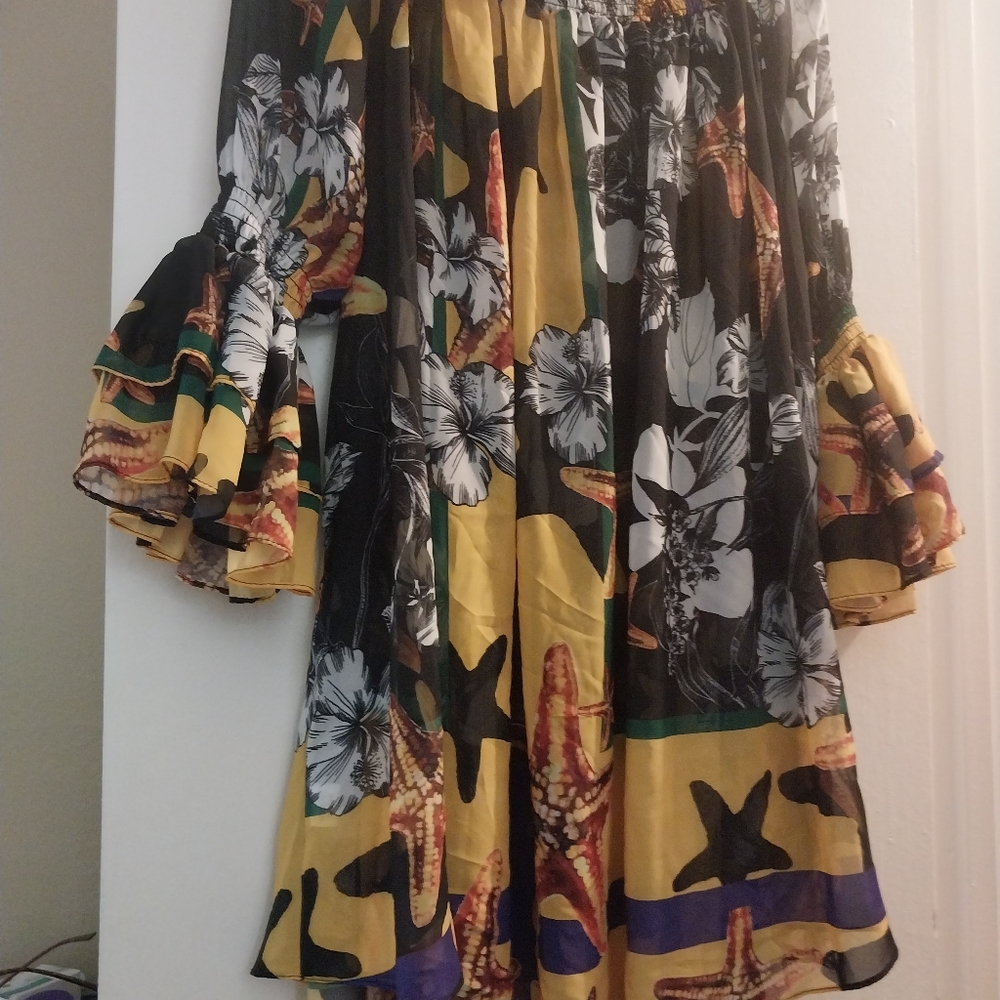 Shirred off the shoulder neckline ruffled bell sleeve multi colored print blouse